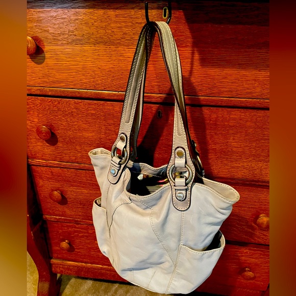 Great condition with clean divided interior. Has zippered compartments. - Picture 1 of 5